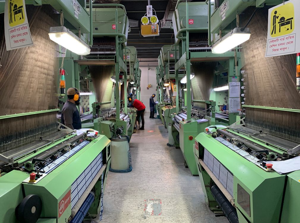 Workers on a textile manufacturing production line